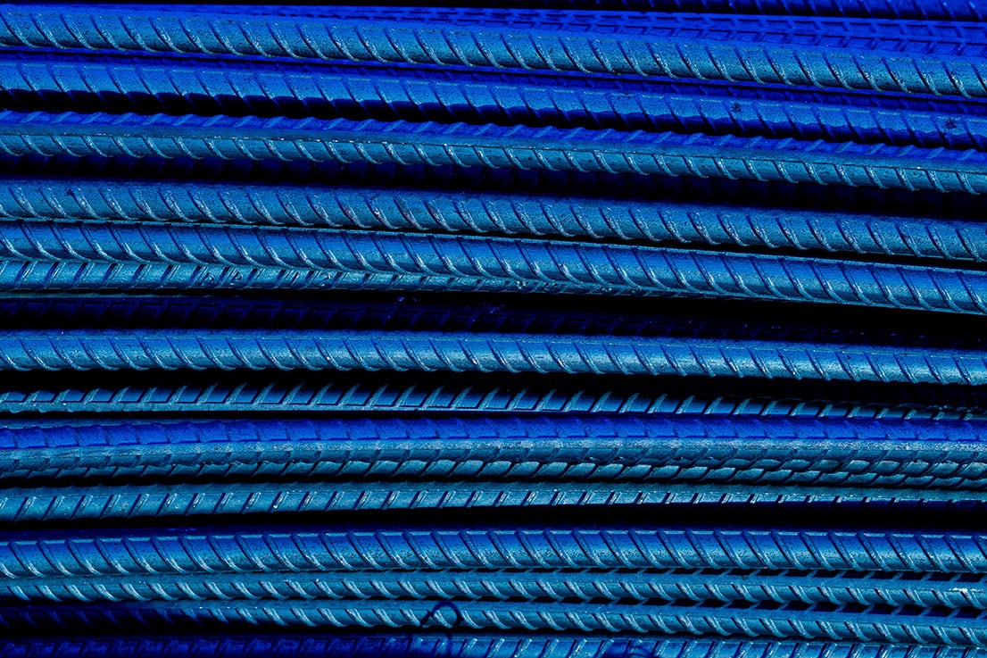 Close view of reinforcement steel bars in an industrial setting.